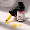 Lifestyle shot of Odacite BI+C Black Cumin & Cajeput Serum Concentrate (Pimples) 0.17 oz with dropper