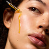 Vintner's Daughter Active Botanical Serum 30 ml - product shown being applied to model's face.