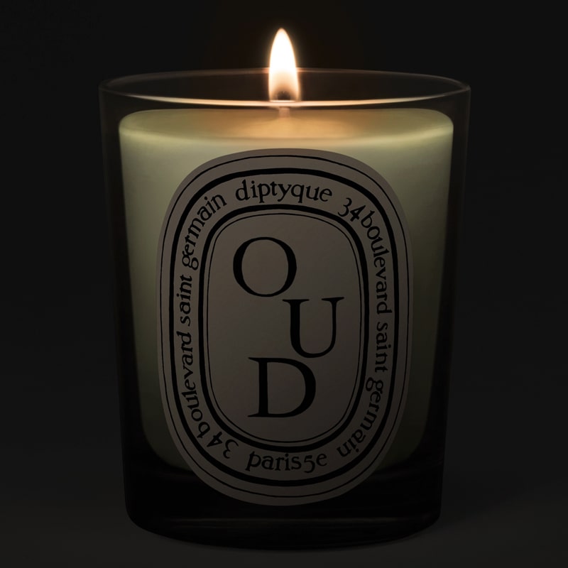  Diptyque Oud Candle - lit candle shown