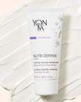 Yon-Ka Paris Nutri Defense Creme (50 ml) shown top view with large product smear in the background to show color and texture