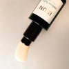 Close up of ISUN Radiant Light Facial Serum (30 ml) showing product swatch