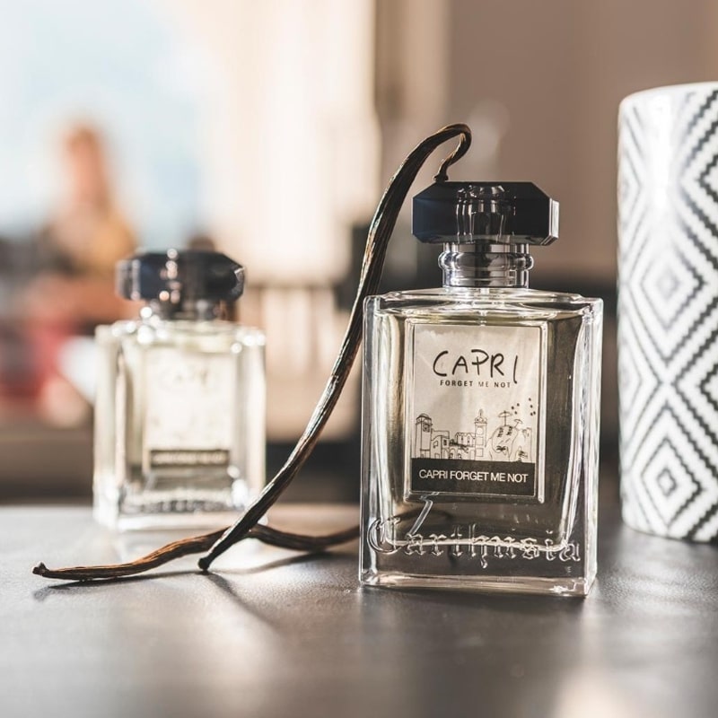 Lifestyle shot of Carthusia Capri Forget Me Not Eau de Parfum (50 ml) with vanilla pods in the background