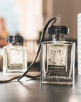 Lifestyle shot of Carthusia Capri Forget Me Not Eau de Parfum (50 ml) with vanilla pods in the background