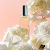 Kai Fragrance Kai Rose Eau de Parfum Spray (1.7 oz) surrounded by white flowers on a pink background