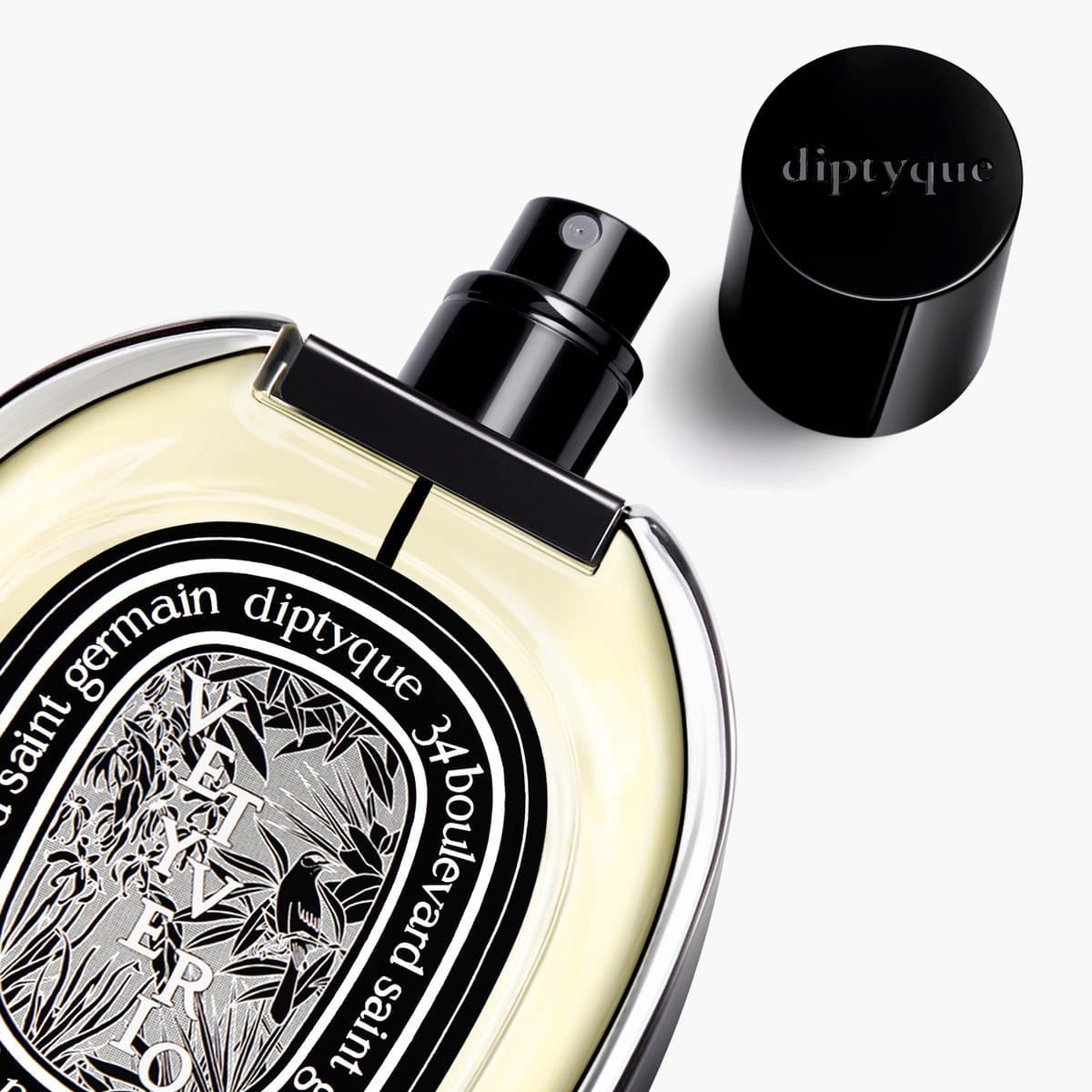 Diptyque Vetyverio Eau de Parfum (75 ml) - product shown laying on its back with lid off. 