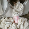 Kerzon Fragranced Laundry Soap - Mega Propre (1 L) - product shown outside of laundry machine.