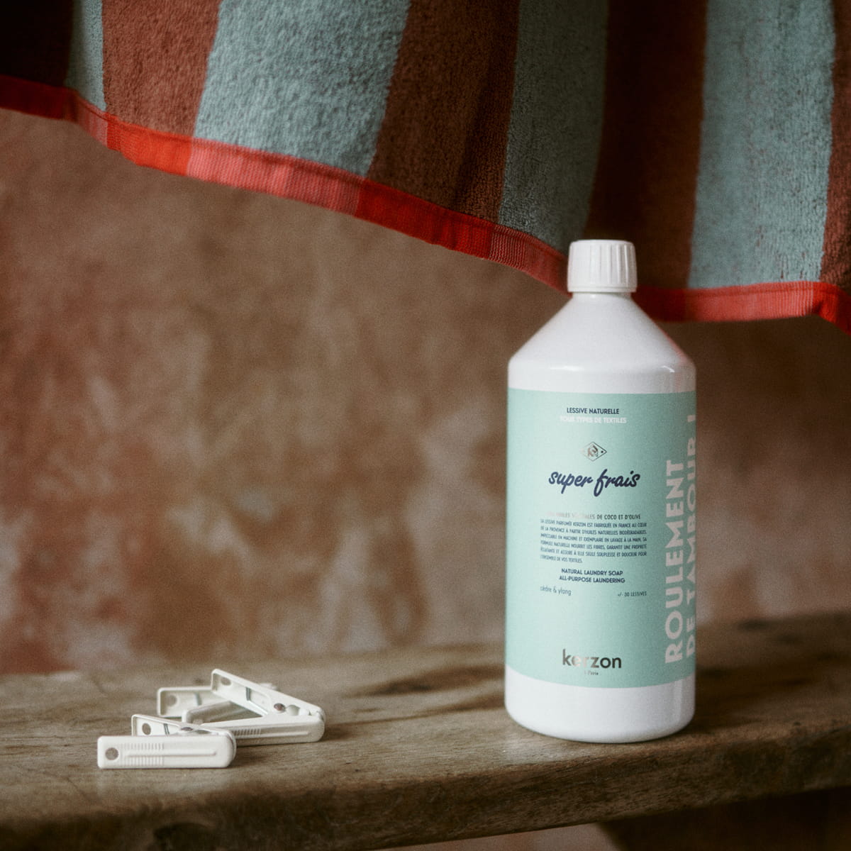 Kerzon Fragranced Laundry Soap - Super Frais (1 L) - product shown next to clips. 