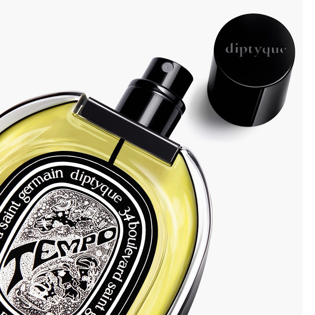 Tempo Eau de Parfum (75 ml) - product shown laying on back with lid off. 