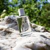 Kerzon Fragranced Mist - Place des Vosges (100 ml) - product shown on rock. 