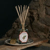 Lifestyle shot of Carriere Freres Tomato Diffuser (200 ml) on dish with stone wall in the background