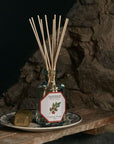 Lifestyle shot of Carriere Freres Tomato Diffuser (200 ml) on dish with stone wall in the background