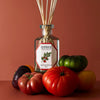 Lifestyle shot of Carriere Freres Tomato Diffuser (200 ml) with tomatoes surrounding diffuser