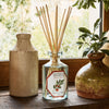 Lifestyle shot of Carriere Freres Tomato Diffuser (200 ml)  with vases and window in the background