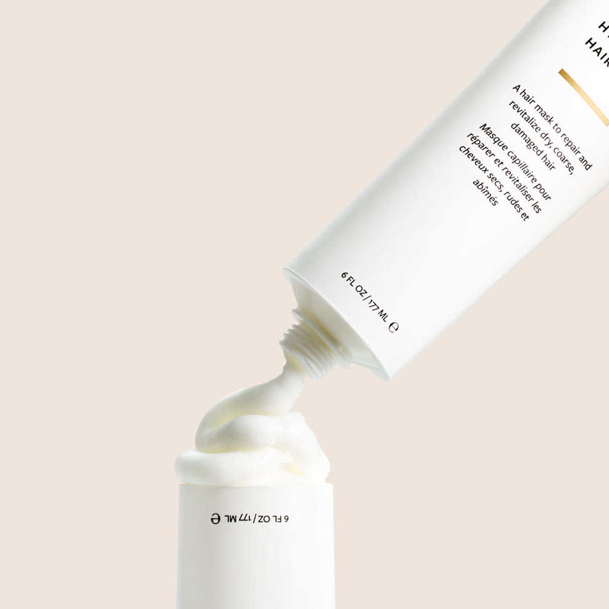 Innersense Organic Beauty Hydrating Hair Mask 4 oz - product shown being squeezed.
