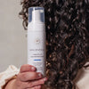 Innersense Organic Beauty I Create Lift Volumizing Foam - model shown holding product next to hair