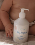 Minois Paris Gel Delicat (Delicate Gel)- Product shown in front of baby