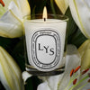  Diptyque Lys Candle (190 g) - product shown on top of lilies. 