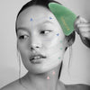 Diagram on face of model showing how to use the Odacite Crystal Contour Gua Sha Green Adventurine Beauty Tool (arrows showing direction of use and motion)