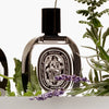 Diptyque Eau de Minthe Eau de Parfum (75 ml) - product shown in flowers. 