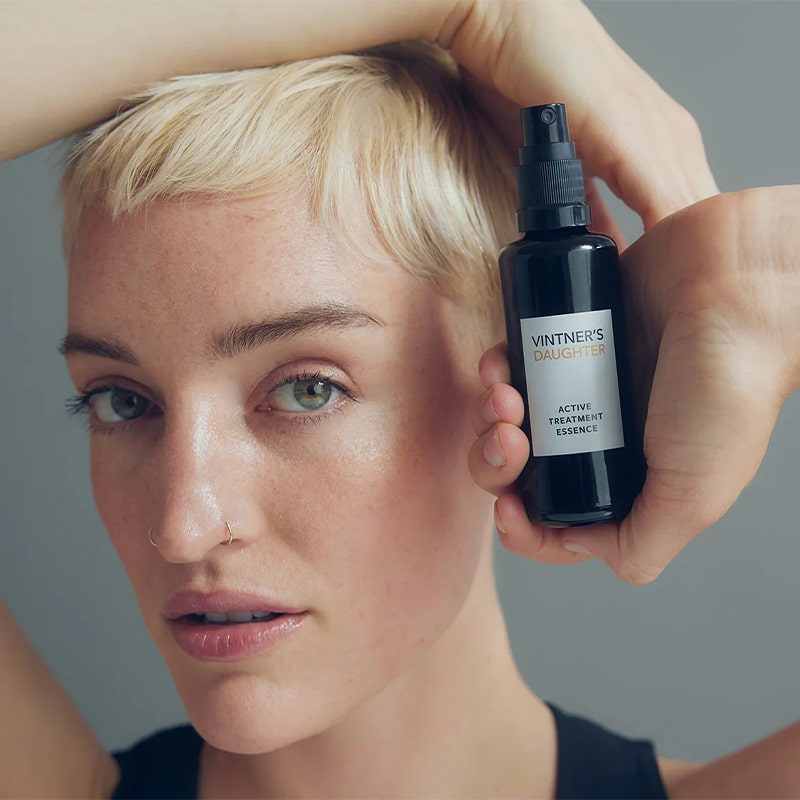 Vintner's Daughter Active Treatment Essence (50 ml)  - product shown being held by model. 