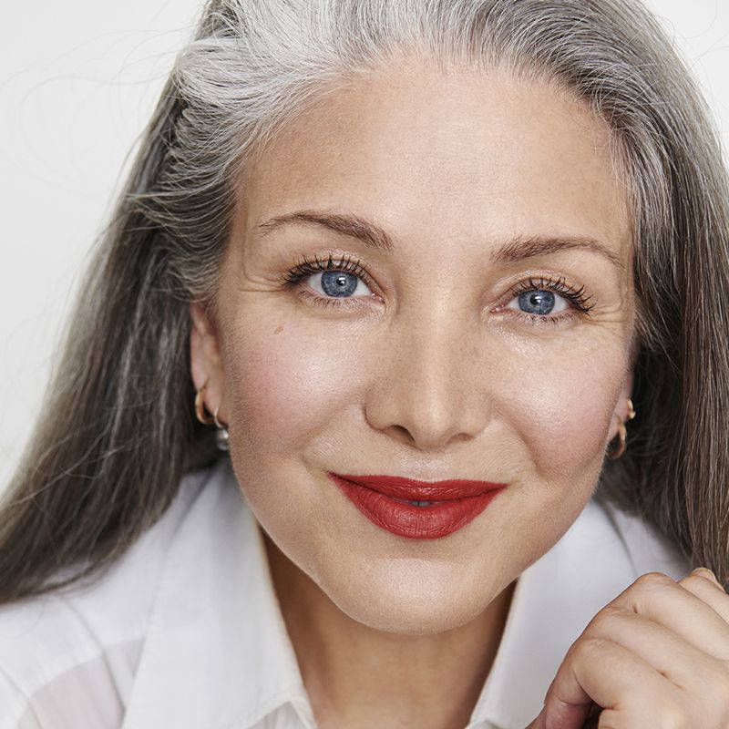 Mature model with fair skin wearing RMS Beauty &quot;Un&quot; Cover-Up Cream Foundation