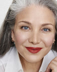 Mature model with fair skin wearing RMS Beauty "Un" Cover-Up Cream Foundation