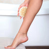 Daily Concepts Daily Detox Massaging Brush - model using brush on leg