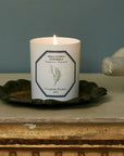 Lifestyle shot of Carriere Freres Tuberose Candle (185 g) shown lit on metal tray