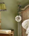 Lifestyle shot of Carriere Freres Lavender Botanical Palet hanging on post of headboard in a bedroom
