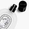 Diptyque Do Son Hair Mist (30 ml) - product shown laying on side with lid off. 