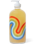 Back side of bottle of Bathing Culture Refillable Rainbow Glass Mind and Body Wash in Cathedral Grove (16 oz)