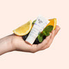 Yon-Ka Paris Alpha-Contour (15 ml) - product shown being held with ingredients. 