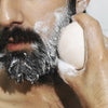 Man using Model using Odacite 552M Shampoo Bar on beard