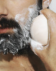 Man using Model using Odacite 552M Shampoo Bar on beard