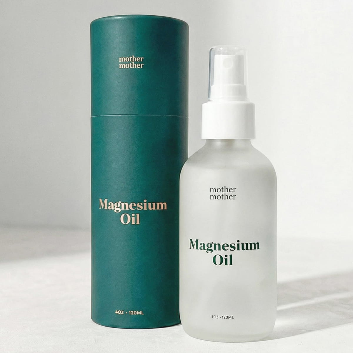 Mother Mother Magnesium Oil (4 oz) - product show next to packaging. 