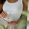 Mother Mother Magnesium Oil (4 oz) - product shown being held by women. 