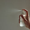 Mother Mother Magnesium Oil (4 oz) - product shown being sprayed. 