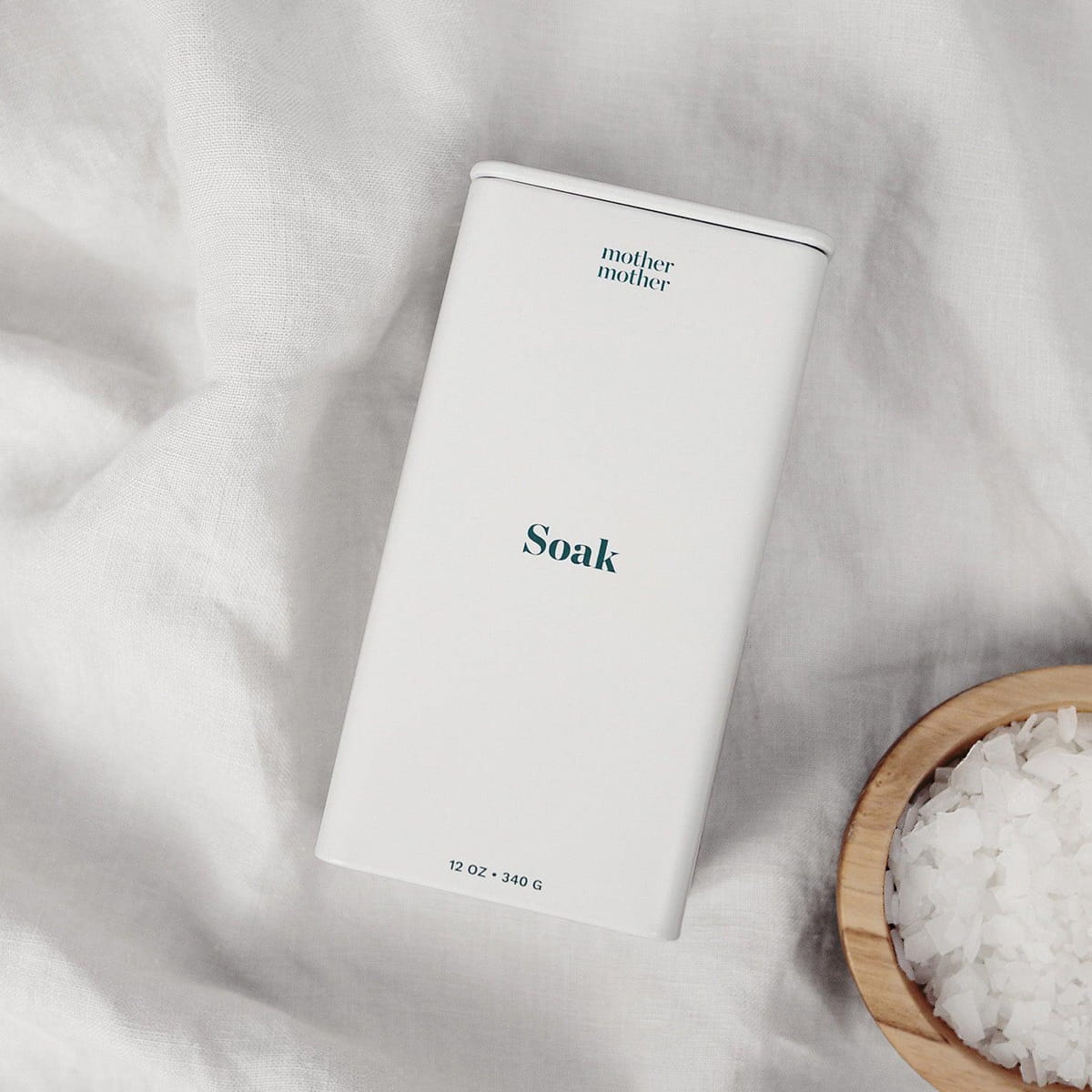 Mother Mother Soak (12 oz) - product packaging shown with product in bowl in corner of photo. 