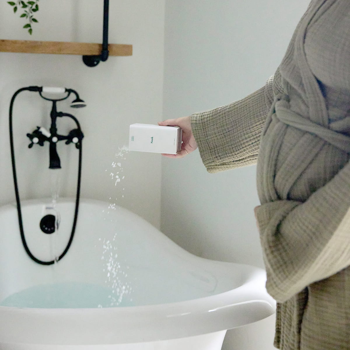 Mother Mother Soak (12 oz) - product shown being poured into bathtub. 