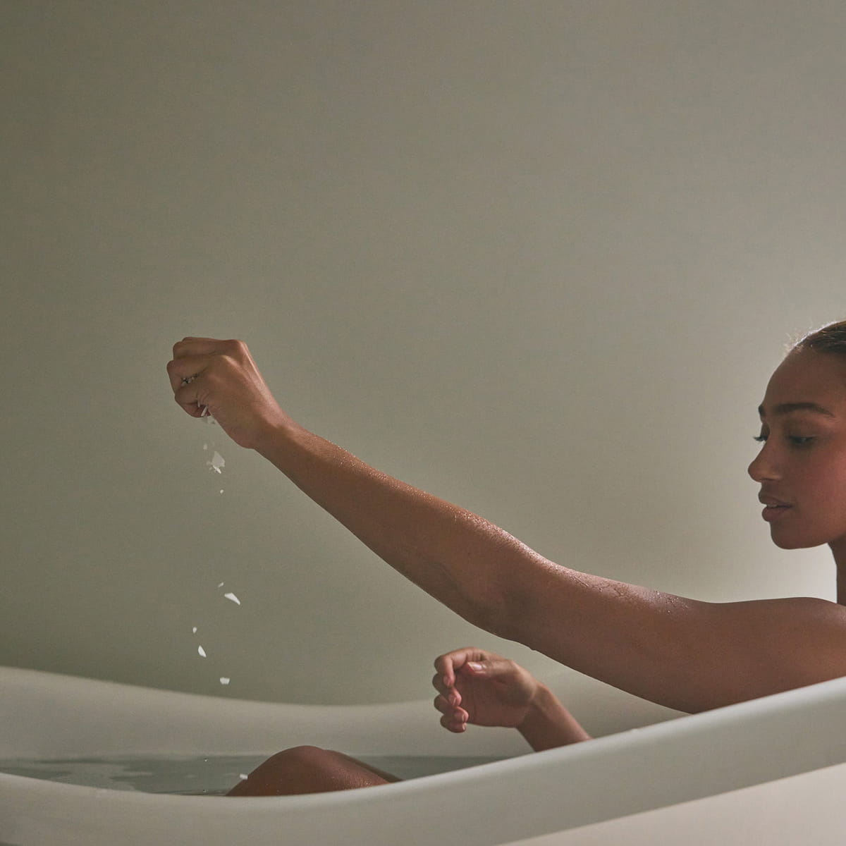 Mother Mother Soak (12 oz) - product show being poured into bathtub. 
