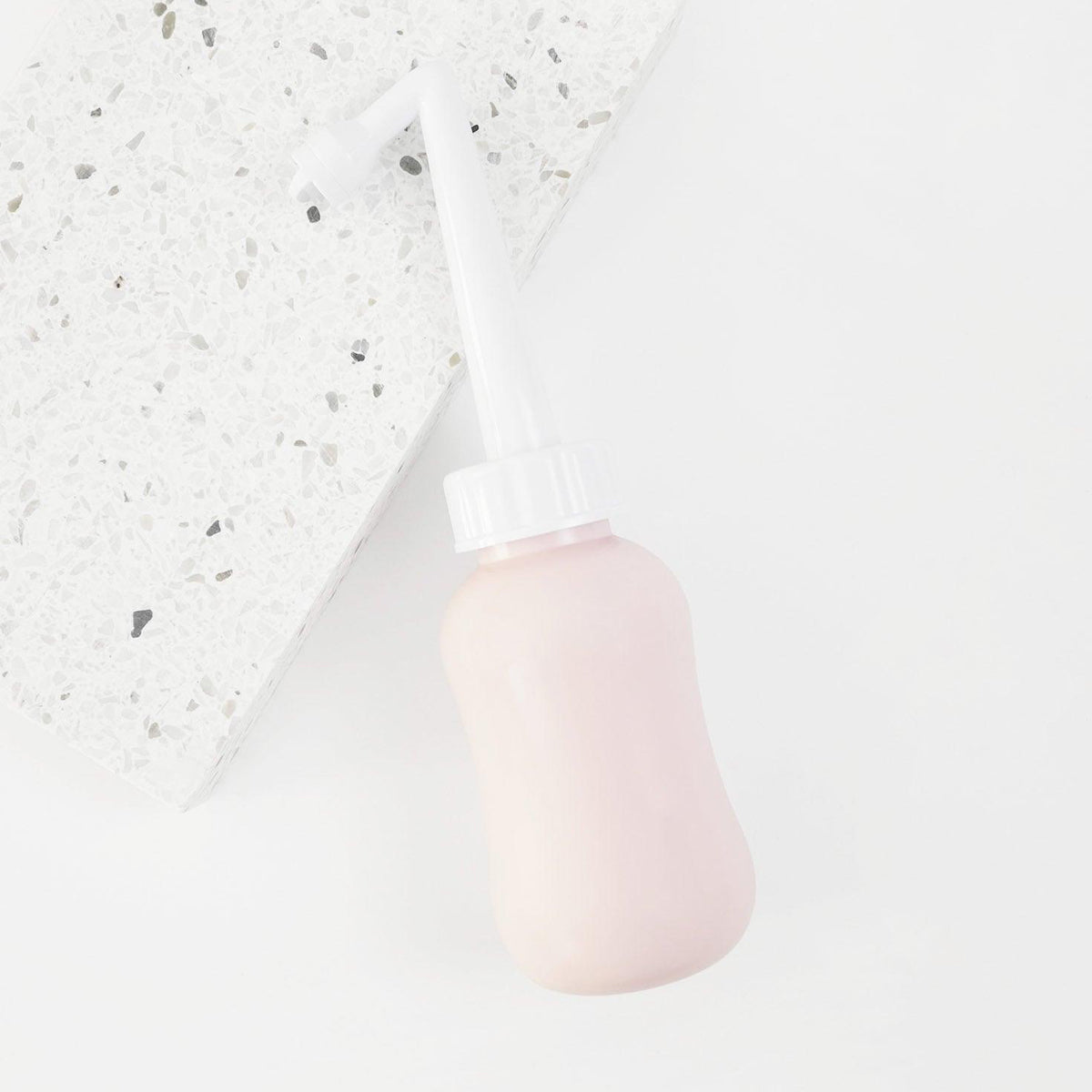 Mother Mother Peri Bottle (1 pc) Pink - product shown on white counter. 