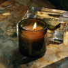 Flamingo Estate Adriatic Muscatel Sage Candle (226 g) - product shown lit on counter top. 