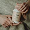 Kerzon Laundry Soap - Maille Caline (500 ml) - product shown being held by multiple people. 