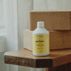 Kerzon Laundry Soap - Gym Tonique (500 ml) - product shown on top of wooden table. 