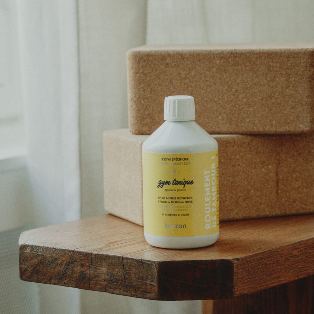 Kerzon Laundry Soap - Gym Tonique (500 ml) - product shown on top of wooden table. 