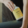 Kerzon Laundry Soap - Gym Tonique (500 ml) - product shown being held by model. 