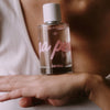 Kerzon Fragranced Mist - Mega Propre (100 ml) - product shown balanced on model's hand. 