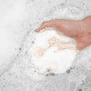 Bathorium Eucalyptus Apothecary Crush Bath Soak - model holding bath soak in bathtub
