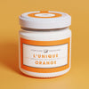 Confiture Parisienne Unique Orange (3.5 oz) against an orange background