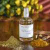Miller et Bertaux Indian Study Eau de Parfum (100 ml) lifestyle shot with ingredients and yellow flowers in the foreground and background